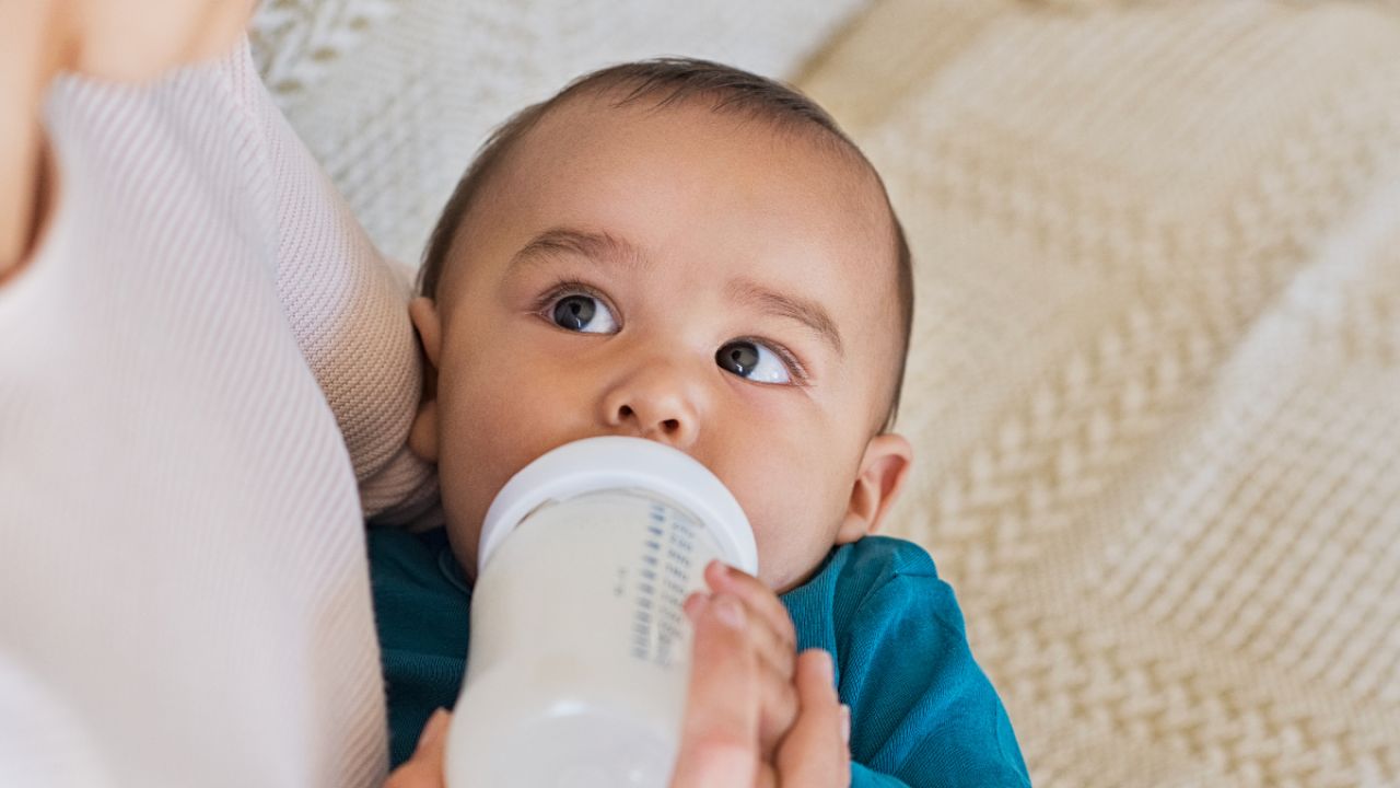 Baby drinking infant formula