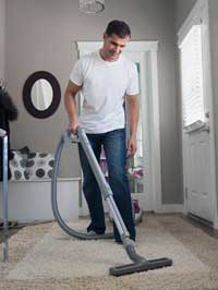 Picture of person vacuuming